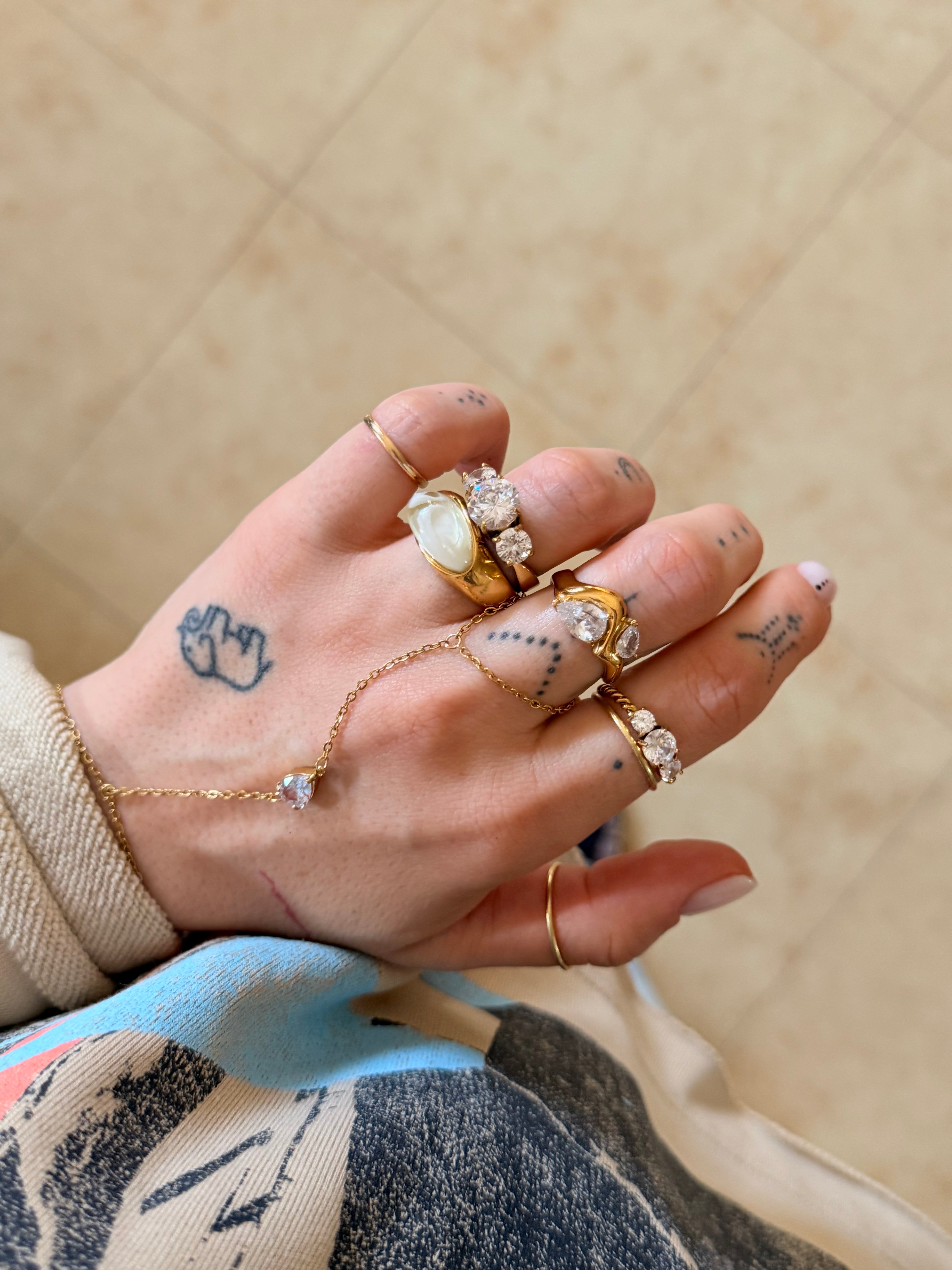 Anello TWISTED ROUND ZIRCON